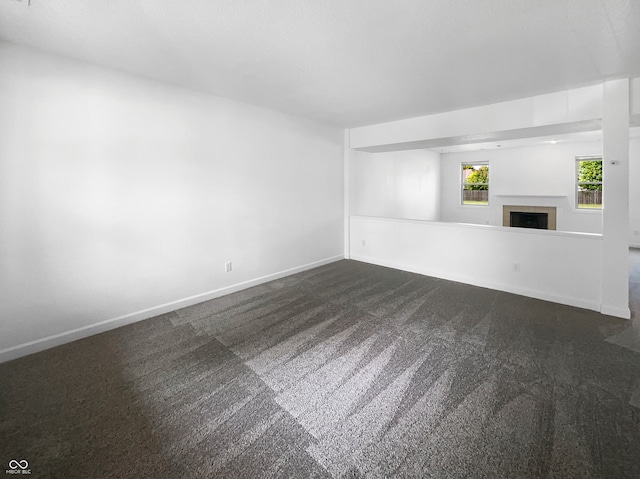 unfurnished living room with carpet