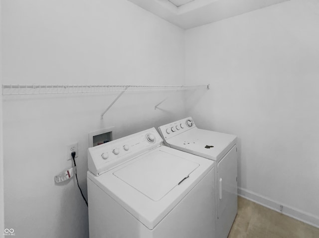 washroom featuring washing machine and clothes dryer