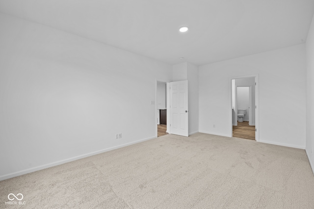 unfurnished bedroom with light carpet