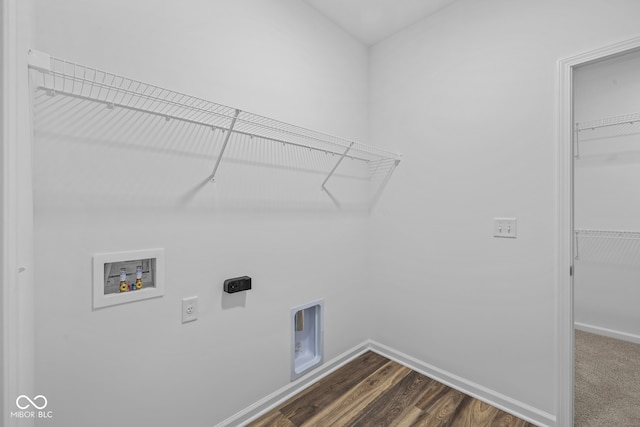 clothes washing area with washer hookup, dark hardwood / wood-style floors, and electric dryer hookup