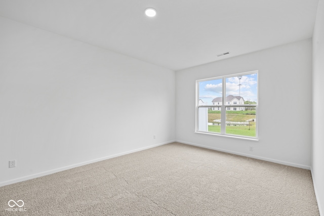 unfurnished room with carpet floors