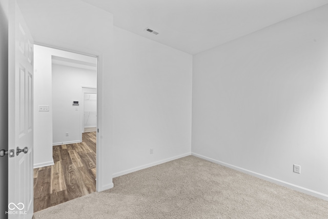 unfurnished room featuring wood-type flooring