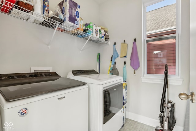 washroom with independent washer and dryer