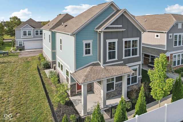 view of front of house with a front yard and a garage