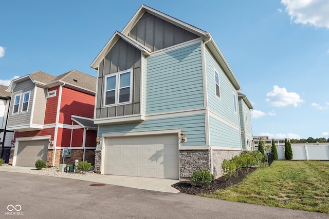 view of front of house with a garage and a front lawn