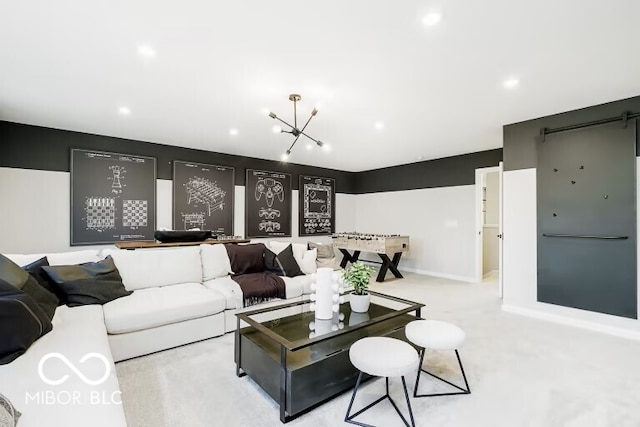 carpeted living room with a barn door