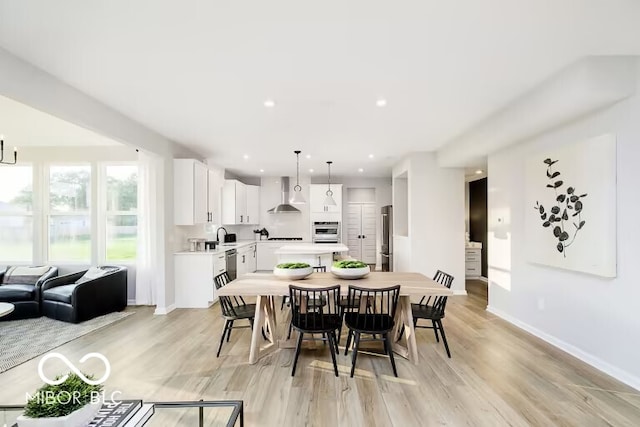 dining space featuring light hardwood / wood-style floors