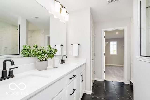 bathroom featuring tile patterned floors and vanity