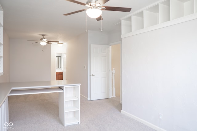 empty room featuring light colored carpet and ceiling fan