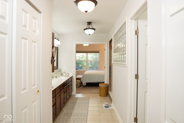 bathroom featuring tile patterned flooring and vanity