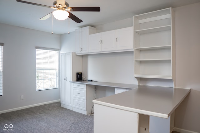 interior space featuring light colored carpet and ceiling fan