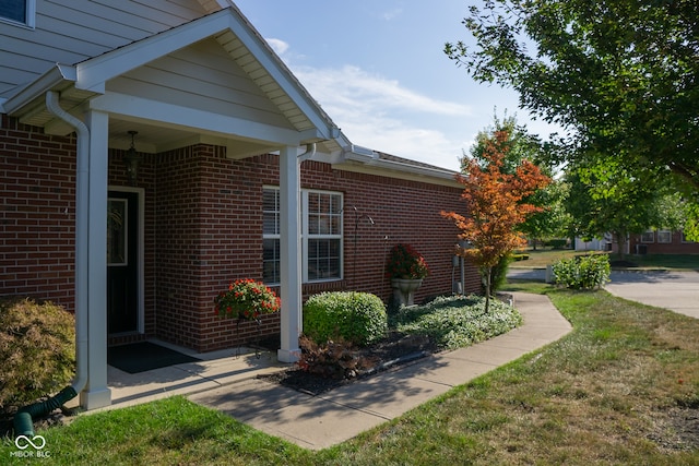 view of property exterior with a yard