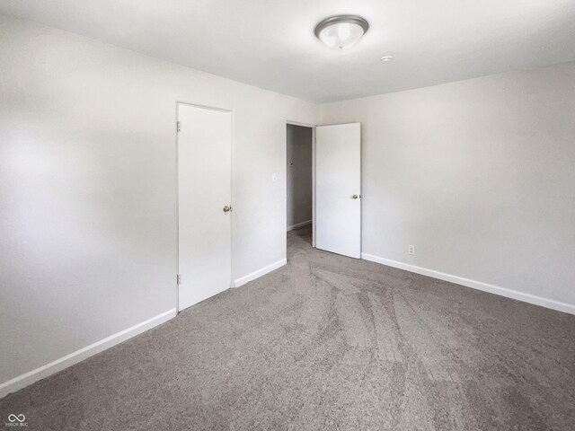 4013 N Graham Ave, Indianapolis, IN 46226 - unfurnished bedroom featuring carpet and baseboards