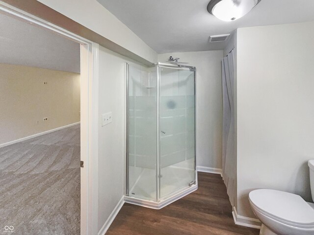 4013 N Graham Ave, Indianapolis, IN 46226 - full bath featuring a stall shower, toilet, baseboards, and wood finished floors