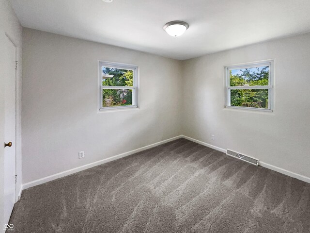4013 N Graham Ave, Indianapolis, IN 46226 - empty room with dark carpet and baseboards
