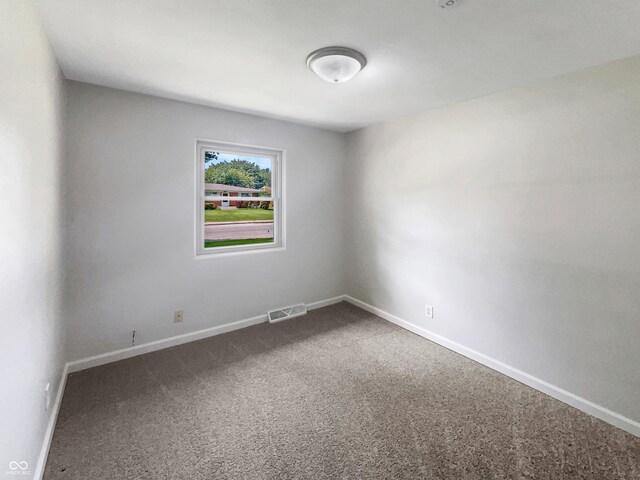 4013 N Graham Ave, Indianapolis, IN 46226 - carpeted spare room featuring baseboards