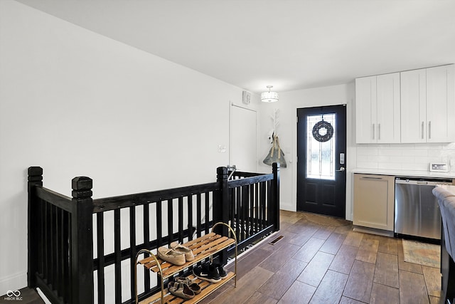 entrance foyer featuring dark hardwood / wood-style flooring