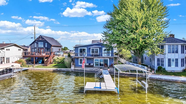 view of dock with a deck with water view