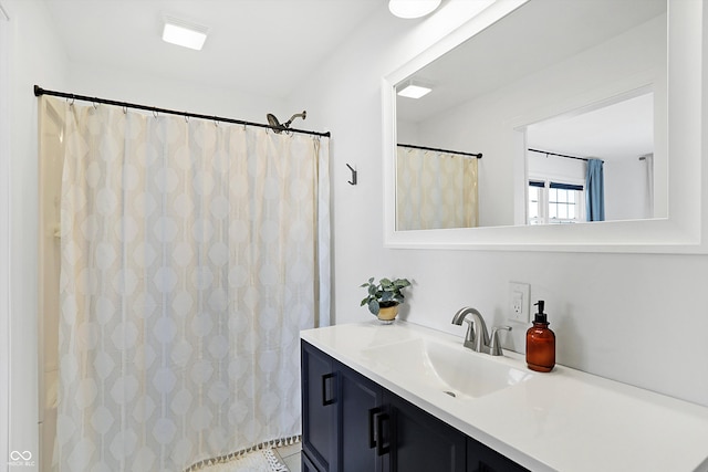 bathroom featuring tile patterned floors, vanity, and a shower with shower curtain