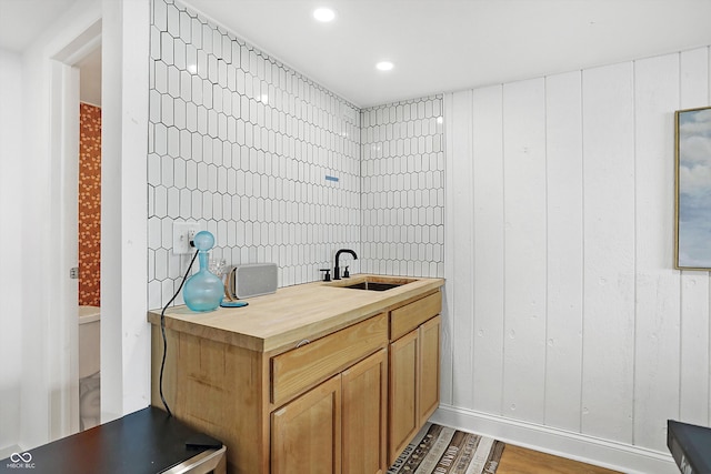 bathroom with vanity and wood-type flooring