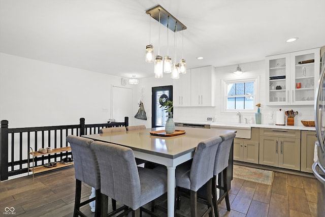 dining area with sink and dark hardwood / wood-style floors