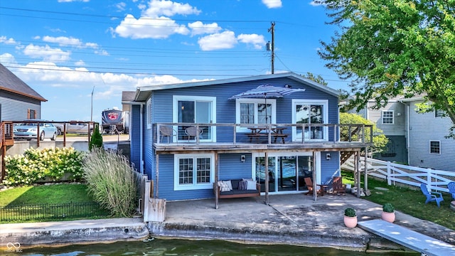 rear view of house featuring a deck