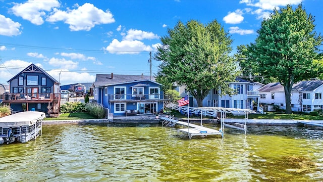 view of dock with a deck with water view