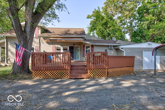 view of front of home featuring a deck and a storage unit