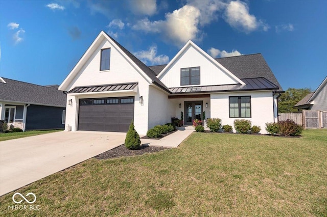 modern farmhouse style home featuring an attached garage, brick siding, concrete driveway, a front lawn, and a standing seam roof