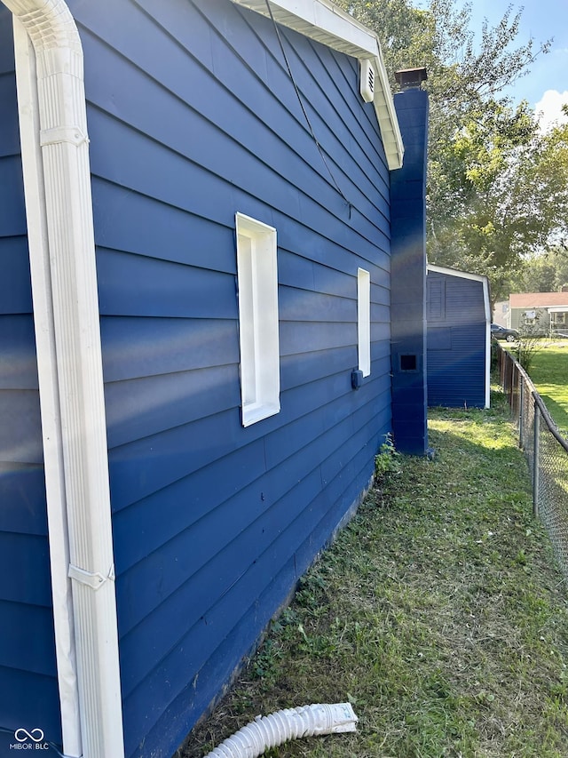 view of side of property with fence