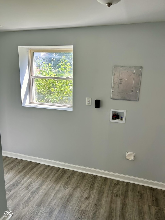 washroom featuring hookup for a washing machine, laundry area, electric panel, and baseboards