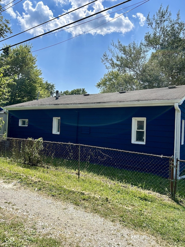 view of property exterior featuring fence