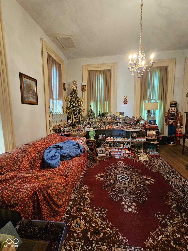 living room featuring a chandelier and hardwood / wood-style flooring