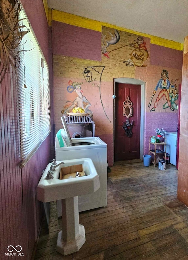 washroom featuring washer / dryer and dark hardwood / wood-style floors