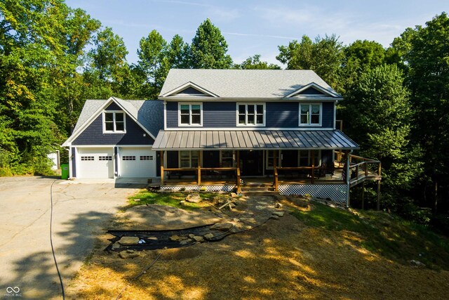 view of front of home with a garage and a porch