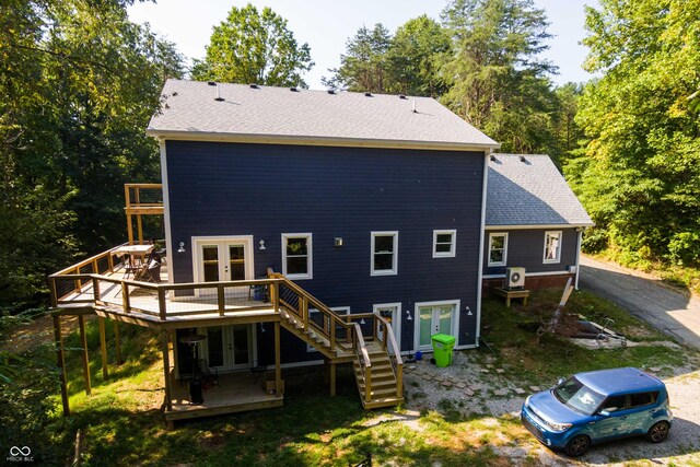 back of property with french doors and a deck