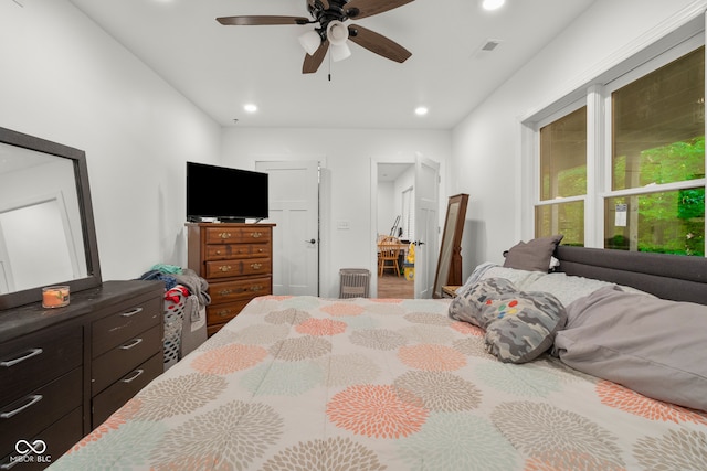 bedroom with wood-type flooring and ceiling fan