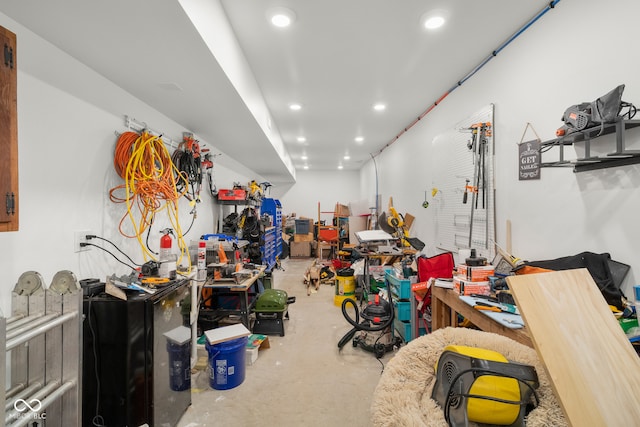 interior space with concrete flooring and a workshop area