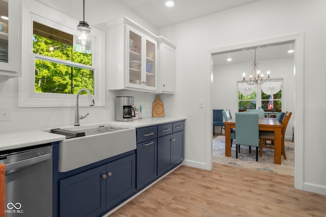 kitchen with dishwasher, a wealth of natural light, light hardwood / wood-style floors, and white cabinetry