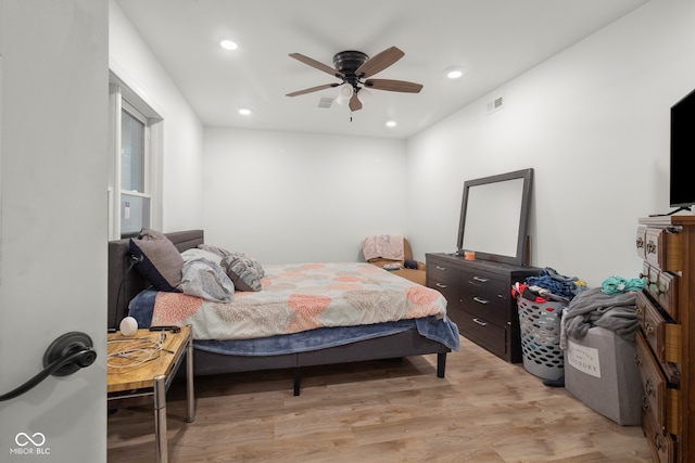 bedroom with ceiling fan and light wood-type flooring