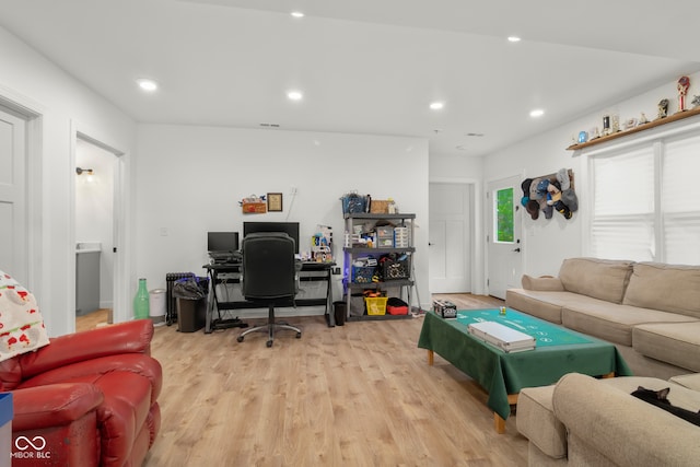 living room with light hardwood / wood-style flooring