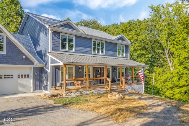 view of front facade featuring a garage and a porch