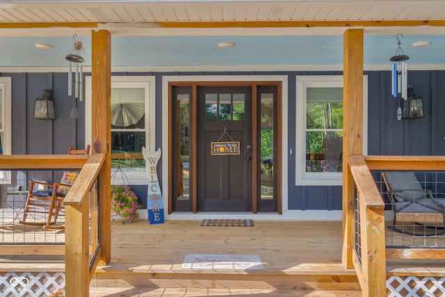 view of exterior entry featuring board and batten siding