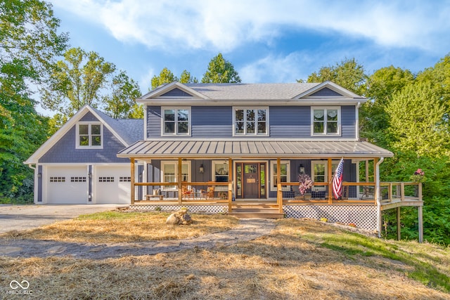 view of front of home featuring a garage and covered porch