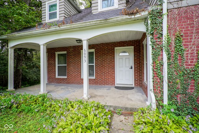 doorway to property with covered porch