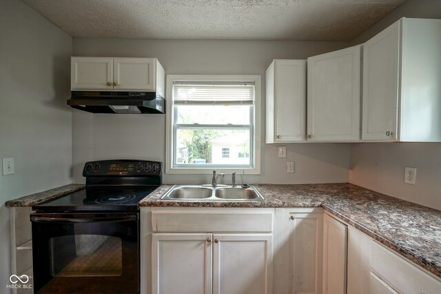 kitchen with a textured ceiling, black electric range, sink, and white cabinets