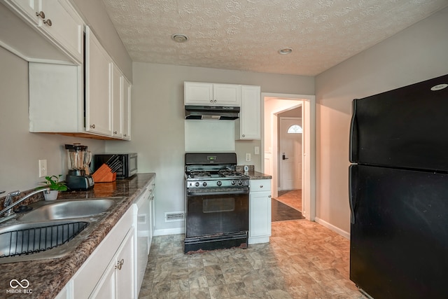 kitchen with black appliances, a textured ceiling, sink, and white cabinets