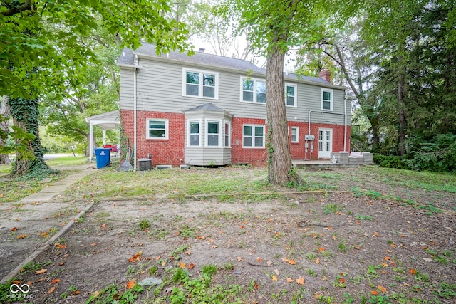 rear view of house with cooling unit