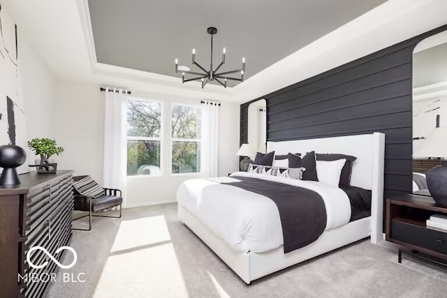 bedroom featuring carpet floors and a chandelier