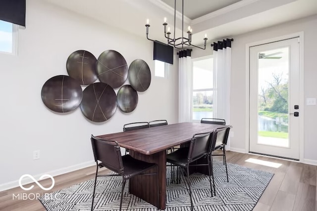 dining space featuring a notable chandelier and wood-type flooring